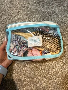 Tula Clear PVC Cosmetic Pouch with Light Blue Trim scrunchies and hair brush